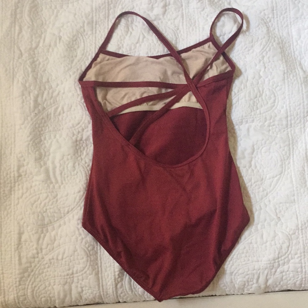 Motion wear burgundy leotard with design on back